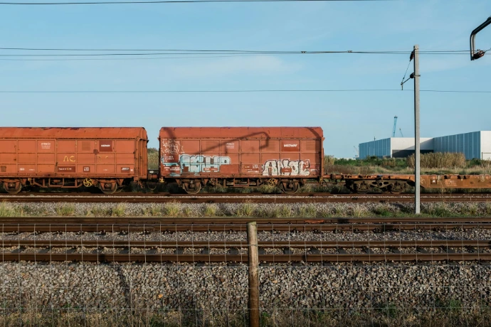 brown train on rail tracks during daytime